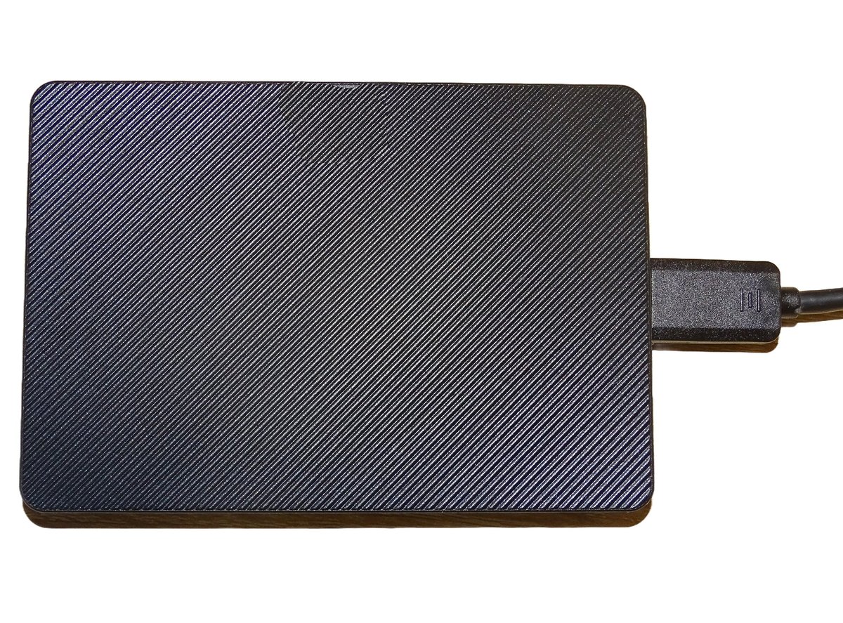 External hard drive with cable isolated on white