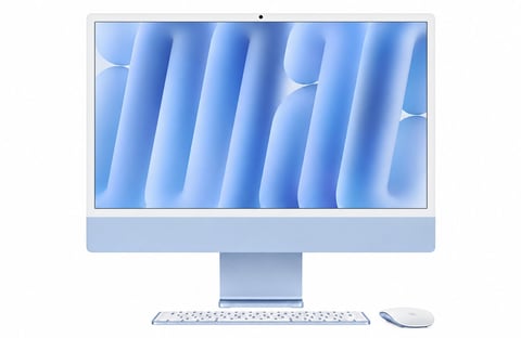 Blue iMac desktop computer with keyboard and mouse on white background